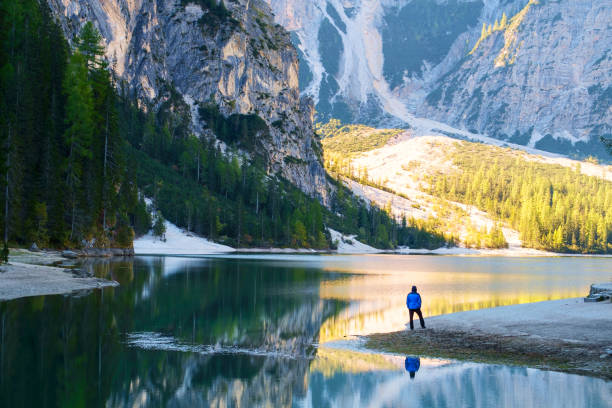 istock Man Traveler standing alone  Braies Lake 914162874