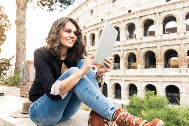 istock Smiling woman in front of Colosseum 914165384