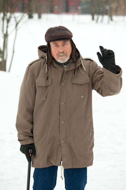 istock Senior man on a walk in winter park 914165686