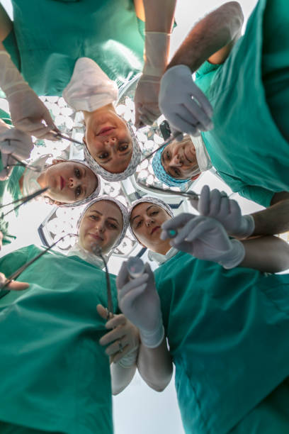 istock Team of nurses and surgeons in surgery 914165830
