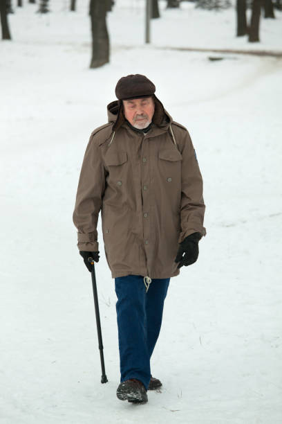 istock Senior man on a walk in winter park 914165910