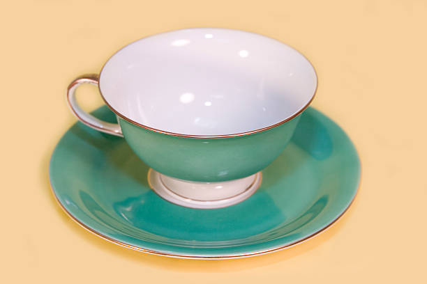 istock Sea Green Cup & Saucer on Yellow 91416810