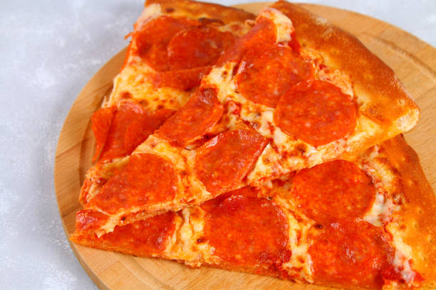 istock Pizza with pepperoni sausages, tomato sauce and mozzarella cheese. 914173336