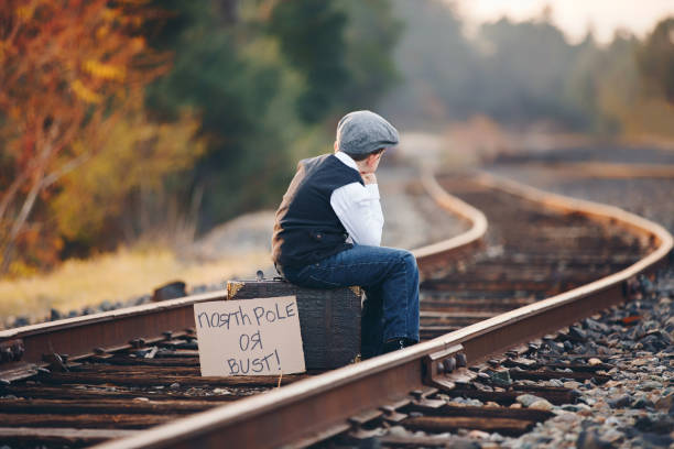 istock Young Boy Waiting Patiently for Train to North Pole 914173338