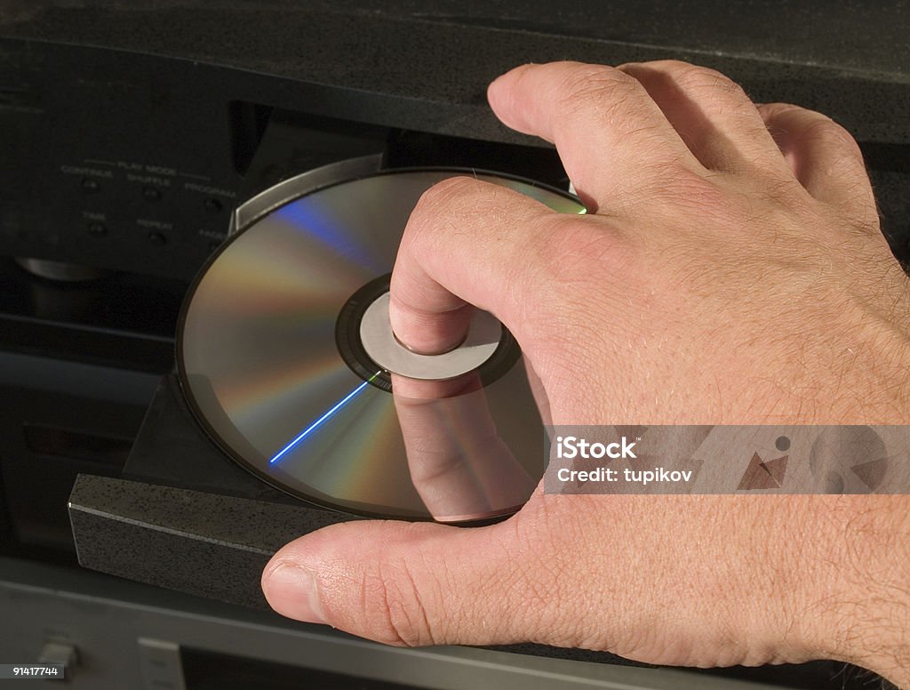 Insérer un dvd dans le lecteur de disque - Photo de Lecteur DVD libre de droits