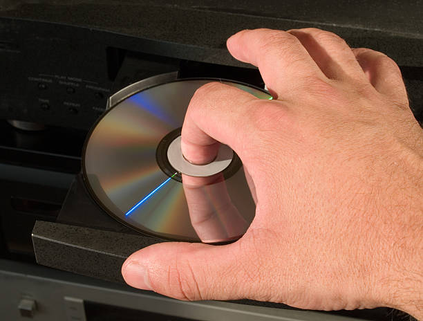 inserting dvd disk in player  dvd player stock pictures, royalty-free photos & images