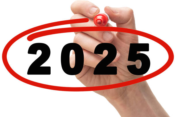 Red marker pen drawing circle around year 2025. stock photo
