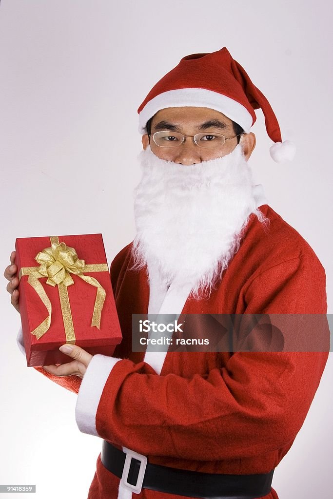 Santa Claus mit einem Geschenk - Lizenzfrei Asien Stock-Foto
