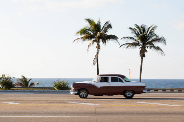 istock Classic Car Driving Along Coast in Havana, Cuba 914183938