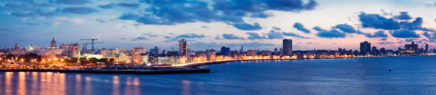 Panorama of Havana Harbour with the Malecon at Dusk, Cuba Panorama of Havana Harbour with the Malecon at Dusk, Cuba havana harbor photos stock pictures, royalty-free photos & images