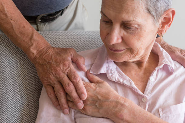 istock Older woman with man's hand on shoulder 914192278
