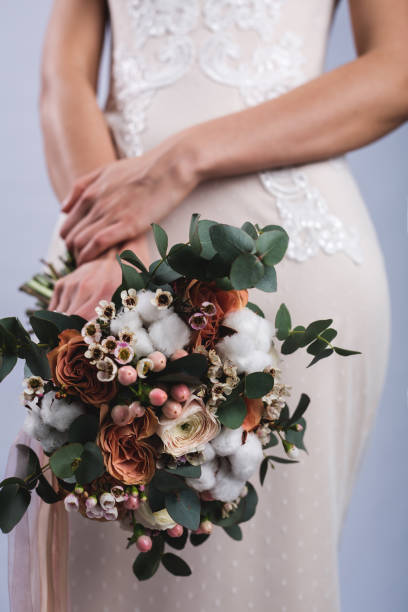 istock Bride holding colorful wedding bouquet 914192586