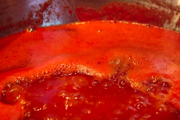 istock Closeup of tomato sauce boiling and reducing down 914193276