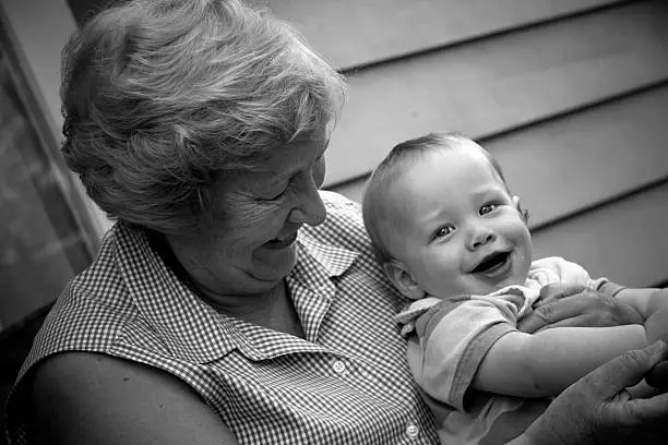 Cute baby boy with his grandmother