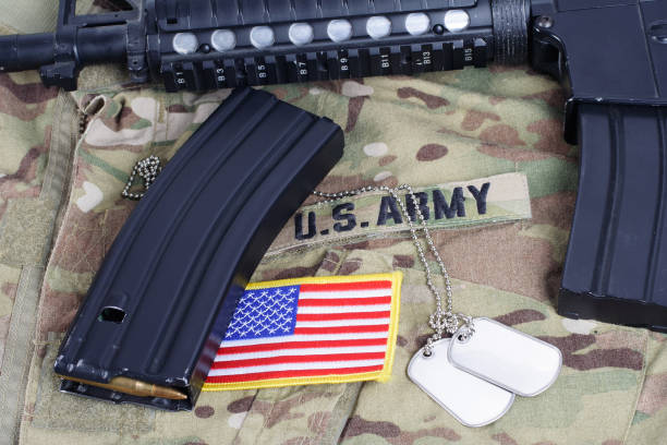 istock M4 carbine with ammunitions  on US Army uniform 914199634