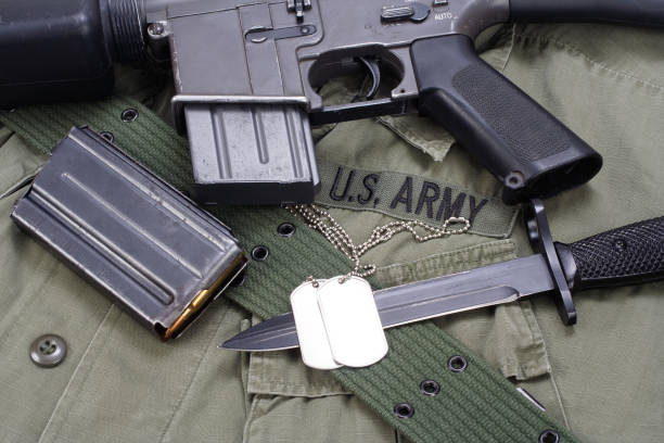 istock M16 rifle bayonet on uniform background 914210242