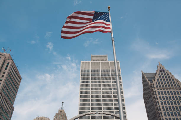 istock Low Angle View Of Flag Against Buildings And Sky 914213344