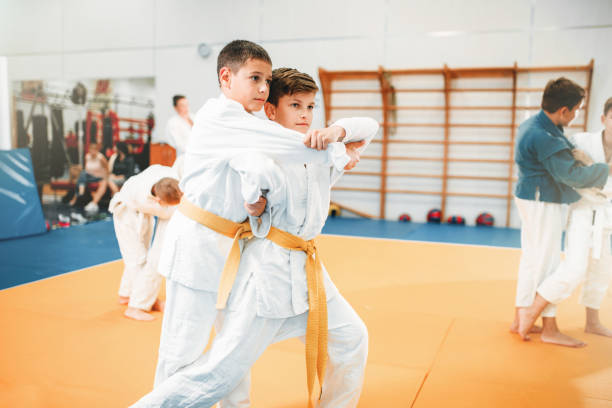 istock Kid judo, childrens training martial art in hall 914219898