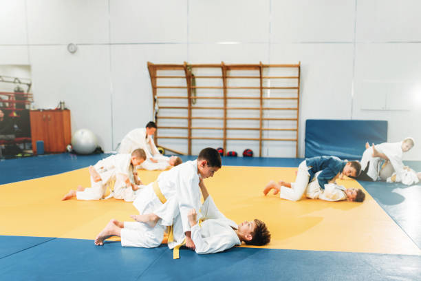 istock Kid judo, children on fight training, martial art 914220114