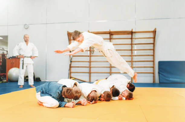 istock Little boys in kimono practice martial art 914220530