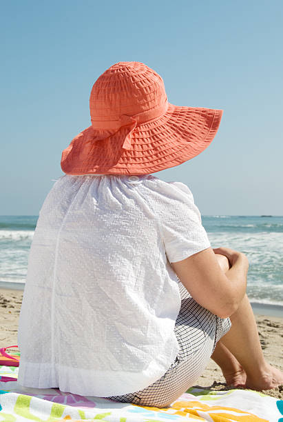 istock Girl Wearing Hat At The Beach 91422798