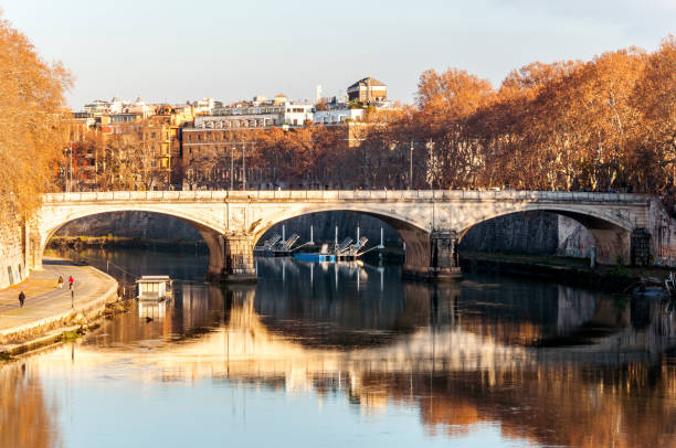 istock Ancient stone bridge on the river in Rome 914235148