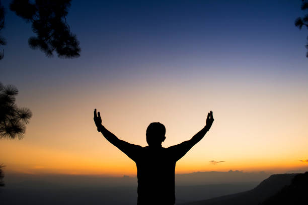 istock Silhouette Man Standing Against Sky During Sunset 914236230