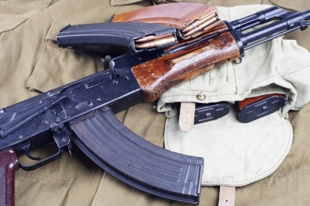 istock AK47 on USSR Soviet Army khaki uniform background 914238788