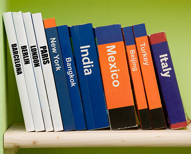 Asian women are picking up books on the bookshelf. To prepare to back to school