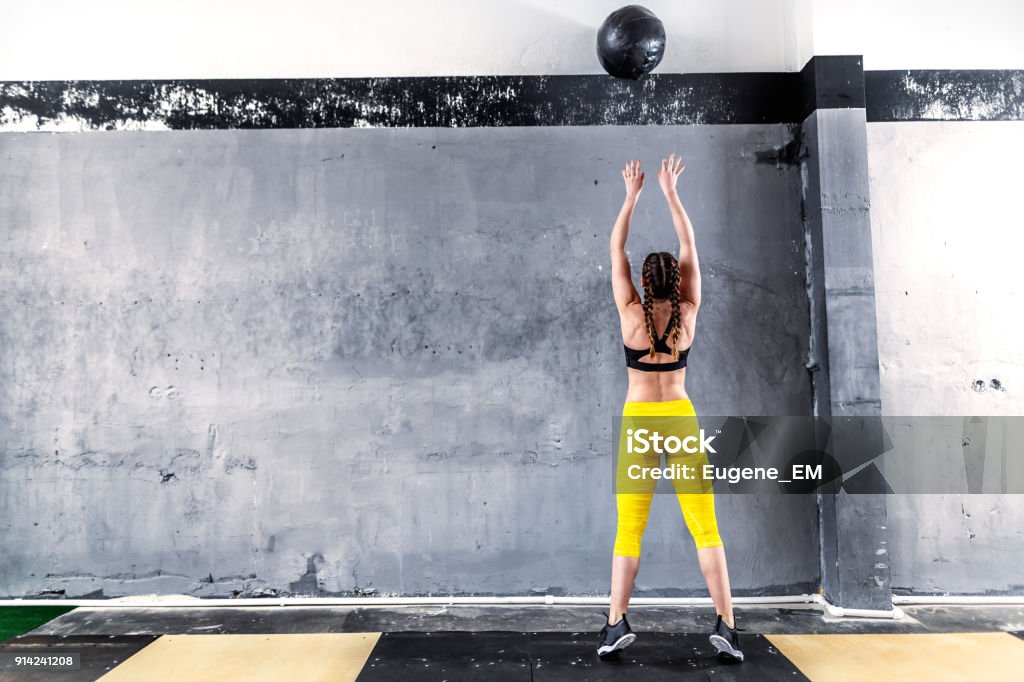 Sporty athletic woman in gym gym Cross Training Stock Photo