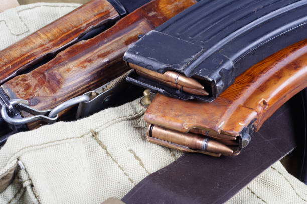istock AK47 on USSR Soviet Army khaki uniform background 914241234
