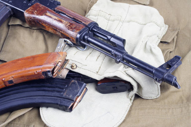 istock AK47 on USSR Soviet Army khaki uniform background 914241550