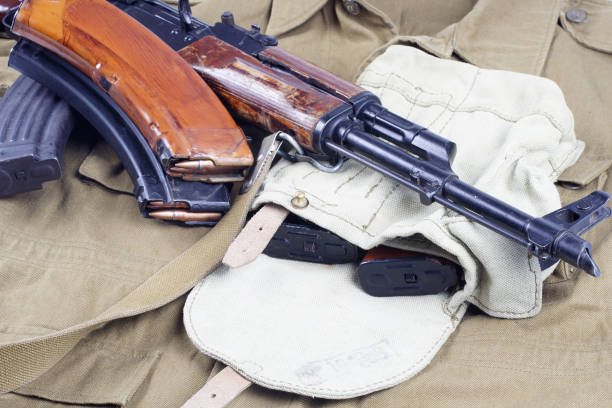 istock AK47 on USSR Soviet Army khaki uniform background 914241740