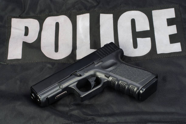 istock Police weapon and equipment on black uniform background 914241868