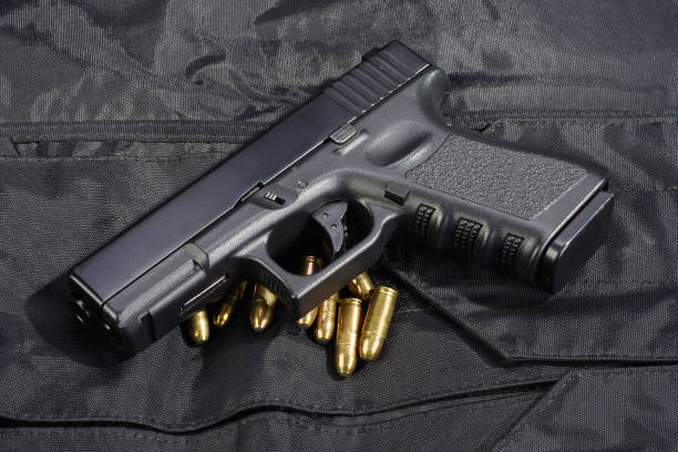 istock Police weapon and equipment on black uniform background 914242342