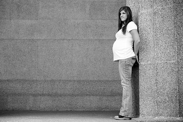 istock Pregnant Woman Standing by Pillar 91426518
