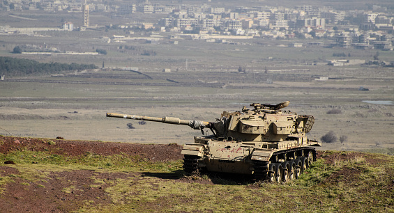 Israeli tank on Syrian border on Golan Heights in northern Israel
