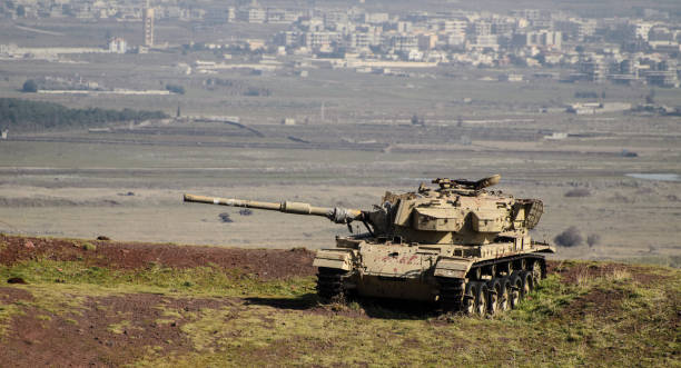 A tank on a Syrian border Israeli tank on Syrian border on Golan Heights in northern Israel armored vehicle stock pictures, royalty-free photos & images