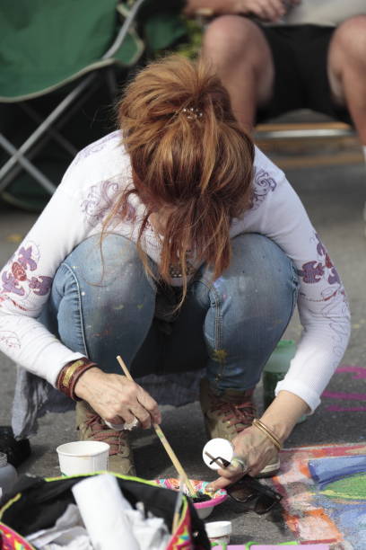 Naples, Fl, USA - January 27, 2017: Naples Chalk art on 5th Ave South. Chalk art when professionals, students, organizations and family artists take over 5th Ave South with fabulous chalk art drawings.