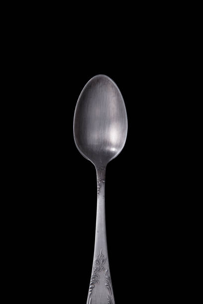 istock Old silver cutlery on black background. 914268850