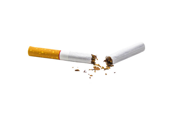 istock Close-Up Of Broken Cigarette Against White Background 914272012