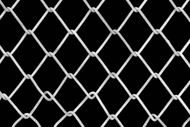istock Full Frame Shot Of Chainlink Fence Against Black Background 914272024