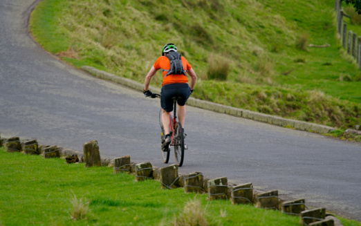 A man cycling up a hill