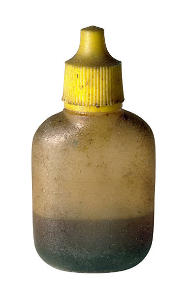 istock dirty old oil bottle with yellow cap 91430210