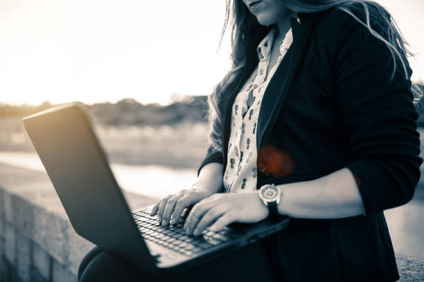 istock Young woman with laptop 914306454