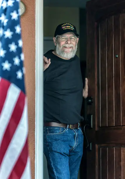 Photo of Authentic Vietnam War Military Veteran Smiling in Open Doorway