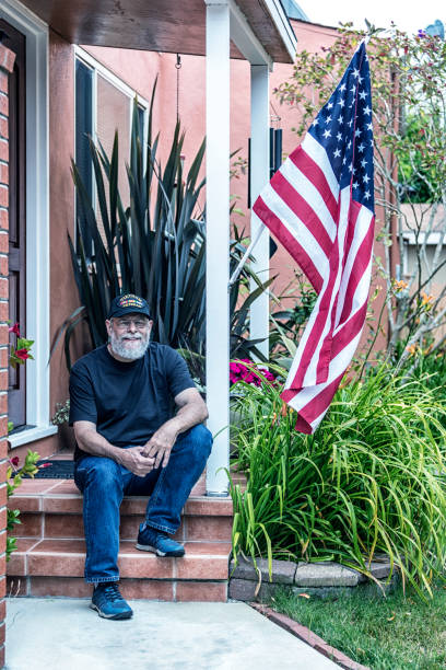 istock Authentic Vietnam War Military Veteran Sitting on Front Stoop 914306654