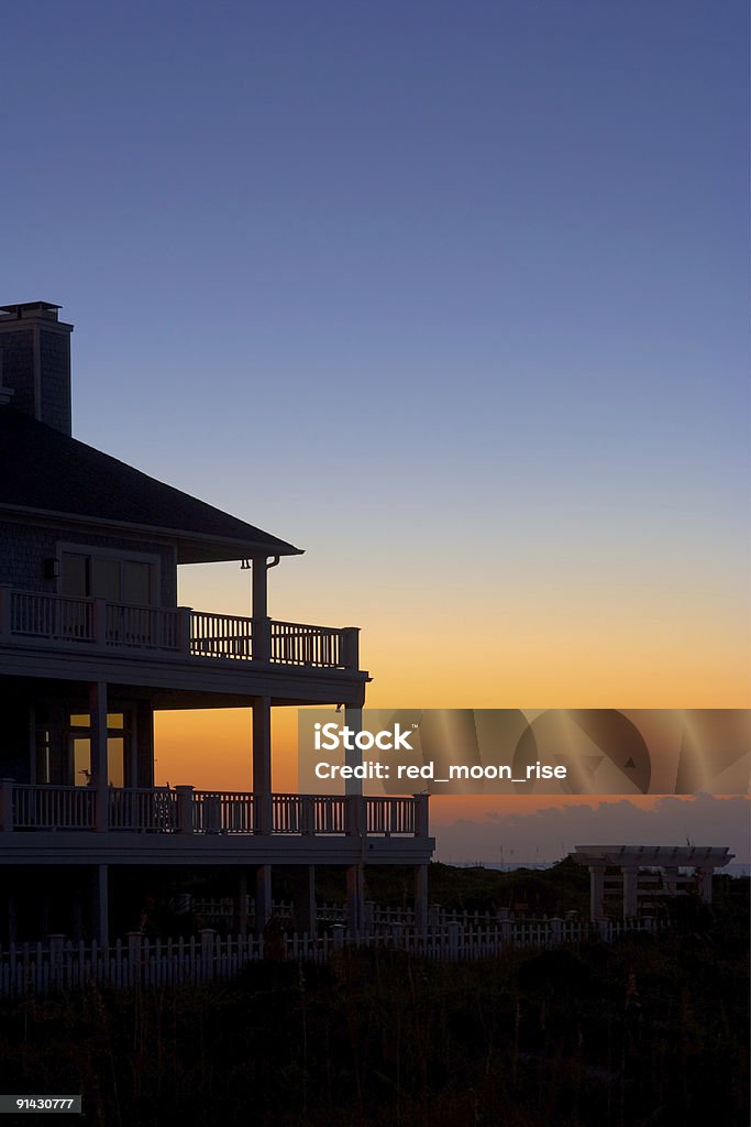 Clear blue orange sky and front porch  Cottage Stock Photo