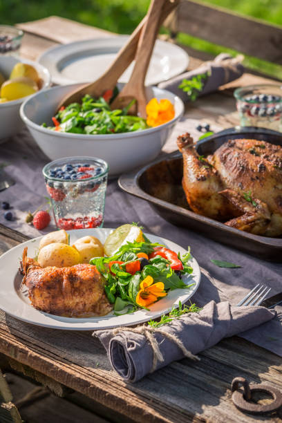 istock Tasty dinner with salad and chicken served in summer 914330440