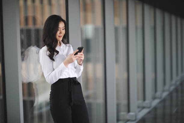 istock Asian businesswoman using smart phone 914331358